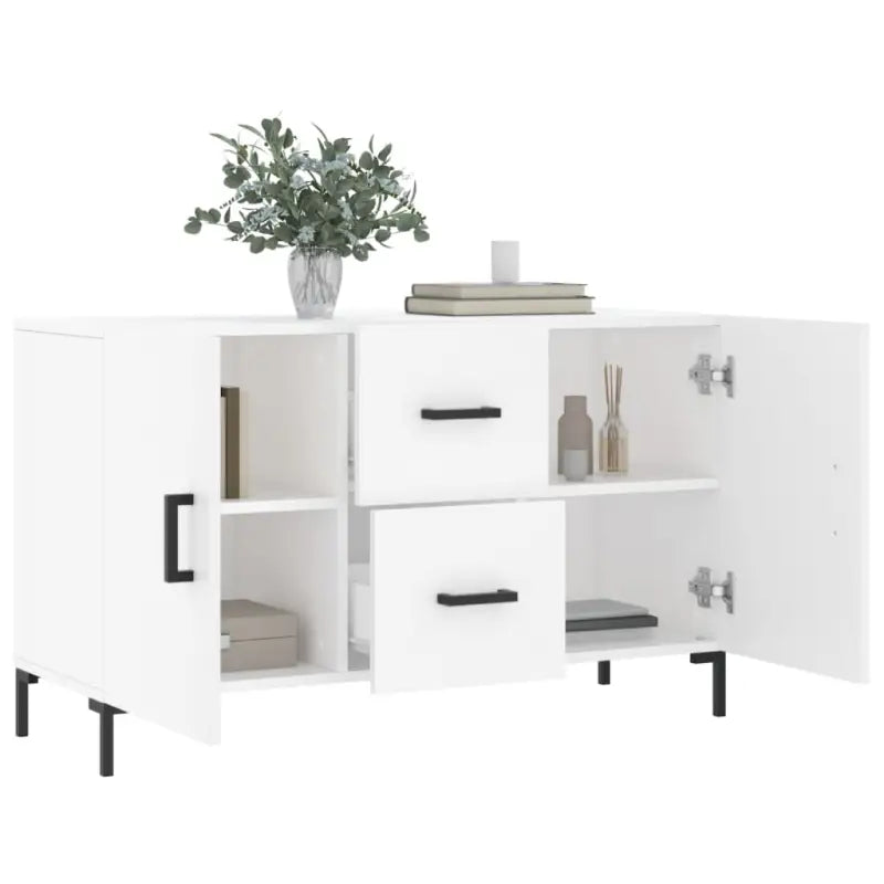 Moderne dressoir met bewerkt hout en metalen poten voor een tijdloze look - Dressoirs & buffetkasten
